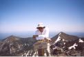WA9TKK on top of Humphreys Peak with some of the other high mountains in the San Francisco Peaks, six of which top 
<p>
11,000 ft.  Geologists estimate that the original volcano of the San Francisco peaks topped 16,000 ft amsl.
</p><p></p>