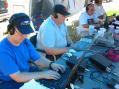 Left to right John N7UPM, John N7AAM, Jerry K7VIT, and Chris N7UBS (GOTA) seek out some hard won QSO's under cold band conditions on a hot early Saturday FD afternoon.  The temperature reached 95° F./35° C.   Photo courtesy of John KX7YT/S21YV.
<p></p>