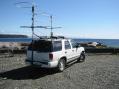 In CO70 just north of the 50 Degree grid line for CO70/CN79 in Campbell River on the east coast of Vancouver Island.   Good overwater shot to Seattle several hundred miles away.  
<p>
Antenna farm top to bottom: 6M loop, 2M 10el, 1296 28el looper, 222 9el and 432 14el 8ft end mounted homebrew K1FO designs.  Had to leave the 903 home, TX power amp stage not working.   Solid 1.25" fiberglass rod front mast and crossboom bolted to an aluminum rectanglular stock mounted to the roof rack plus a hitch mounted rear pole withstood the miles of overgrown brush and logging road potholes.</p>