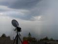 A small squall line with light rain crosses the NLRS Eagle Harbor, MI operating site. The dish is looking west (314 km) toward the Minnesota side of Lake Superior.
