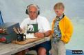 W1GUA, Rudy, shows Grandson Collin how it's done at the W1IM 2A operation in East Lempster, NH