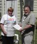 Steve, K2CX receives a certificate of participation from Cathy Pearsall, KC2ACJ SCRC president