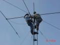 Alan W8OP and Greg N8TJD bolt the beam on the tower. -K8UQY Photo