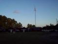 Field Day site at sunrise with 40' tower supporting 40 meter loop, G5RV, and 2 meter beam