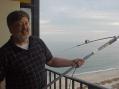 Marty, W4MY, with the homebrew buddipole on the 18th floor balcony