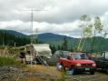 HF operations are underway in the tent trailer; the tower on the ladder is about to receive a complete set of antennas for VHF and UHF.  After this tower goes up, it's 100% operating for the AC7FT gang!