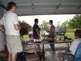 Most of the W8LT field day ops.  From Left to Right - Mike (back to us), President Dan, Matt (our host), and Mark.  This picture taken just before start of operations on Saturday afternoon.