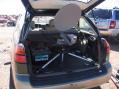 The dish mounted in the hatch back of the subaru.