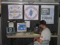 Casey Lofthouse, KD7HUS, setting up the HF station inside the trailer.