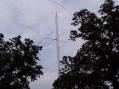 Our "big stick".  60 feet of Rohn 25 with a 10 foot pole on top to support a 2 element 40M inverted V beam.  Tribander at 45 feet.