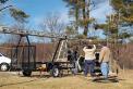 KI4PKW, KG4YVA, and KU4JZ prepare the mast and tower supporting the 50 and 144 mhz. yagi antennas.