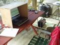 Here's the station underneath my Dad's deck. It kept the sun and rain off beautifully. We put a tarp on the deck and then we draped another one off the side. It took 5 minutes and voila! A shelter!