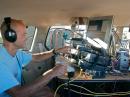 Ed Parsons, K1TR, of Windham, New Hampshire, operates the 2010 September VHF QSO Party as a rover. Here he is in his "shack," located in the back of his minivan. [Photo courtesy of Ed Parsons, K1TR]