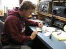 Working on a beacon/receiver pair prototype for the IEEE foxhunt. [Sterling Coffey, N0SSC, Photo]