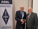 The ARRL Board welcomed two first-time Board members; Treasurer John R. Sager, WJ7S and Hudson Division Director Vice Director Nomar Vizcarrondo, NP4H. In this photo, President Rick Roderick, K5UR (right), presents an ARRL pin to new Treasurer John R. Sager, WJ7S.