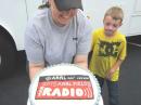 KD8CXS and son Wyatt show the 2015 FD Cake!  Enjoyed by all... and good breakfast!