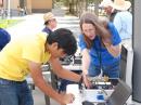 Rohan Agrawal - KJ6LXV (left) and Judy Hatchin - KK6EWQ (right) working on the packet station.