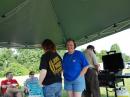 Leif W0RDE, Cindy Chesley, Rebecca KB0VVT, Holly KA0VTB, and Roger W0KWJ gathering around the food tent.

