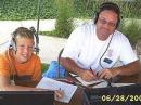 Austin KC9DEL and his dad Sam KA9VHQ work 40M together during Field Day 2003. Photo by WD9EED
