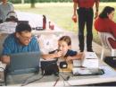 Jim, K5RX, mentoring a future contester on the GOTA station, 9 year old Sarah.
