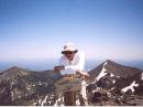 WA9TKK on top of Humphreys Peak with some of the other high mountains in the San Francisco Peaks, six of which top 

11,000 ft.  Geologists estimate that the original volcano of the San Francisco peaks topped 16,000 ft amsl.
