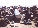 WA9TKK operating in one of the rock shelters on Humphrey's Peak.  Just above my head on the wall is the FT-290 with 

part of the telescoping half-wave 2m antenna visible, to my right is the T-81A with 6m whip, and the far right on the 

wall is the Arrow 3 element 70cm yagi.