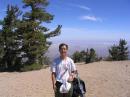 Hon, kq6ee, standing at the top of Mt. Baden Powell ready for the big day (cq contest). The background is northern desert.