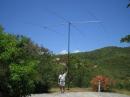 Chip, K7JA with the 20 CW Yagi. The foreground slope is about 25 degrees!