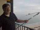 Marty, W4MY, with the homebrew buddipole on the 18th floor balcony