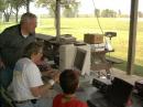 Jim Hain and Jason Dugosh look on as AA9VT demonstrates APRS (XASTIR) on a Linux box. Sorry, John!  I don't think they're any bonus points for a Linux demo!