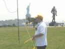 WB2CRD helping to set up an antenna at Field Day 2002