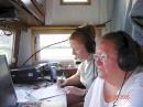 N1NFO Lisa Rigoulot (background) and KB1JDN Sally Landry (logging) worked many hours on the radio plus did cooking for the whole crew..Thaks to all of you !!