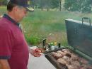 Gary Carroll, WØQN grilling the steaks to perfection for the Saturday evening Field Day dinner.