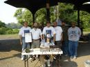 From Left to Right: Gabe KB2MAR, Cliff KC2CXL holding the Mayor's proclamation, Brad KC2CGI, Lou KB2DHG, Efrem W2CZ, Darwin KC2CMQ, Frits KB2O and Dan AA2HX seated making CW contacts