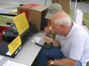 Williamson Co Red Cross Exec Director Tom Peters makes his first Ham Radio contact with W4UR at the GOTA Station