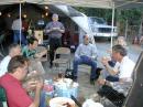 (Clockwise) Ed VE7ED, Ken VE7KFB, Gary VE7GGJ and John VE7RO chow down with a few visitors.
