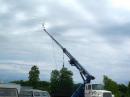  Main Antennas in Mid-Swing - the crane first swings up and then extends to height.