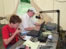 N9AWG Rahlf coaching KC9FVR Winston at the tent based operating position.