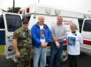 Tony Hamill (CAP leader), Bill KH6GJV (SCM), Jim Smith (County Supervisor), Marci KE6IAU (Club President) in front of one of two of the clubs converted ambulance comm-vans.