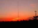 Red sky at night, sailor's delight!  It doesn't get any better than this.  A special thanks goes to Roger-K0MPH for the nifty photo of the 4 element 20M vertical dipole array we affectionately call the N0FP Eggbeater.  This should be the cover of a QST!  The tower and array goes into the air in about an hour.  The fiberglass 46' tower also held the north end of the 80M dipole (not visible here) all night long.