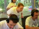 Katie, KE4DRL checks the progress as Joe, KE4DRJ operates and Mike, WA4BPJ logs.