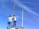 6 meter beam is added below the 2 meter cross polarity beam with the 20 meter beam in position by N6PMF and KG6UHJ.