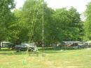 Portable tower in the foreground, campsite in the background