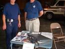 KI4KOW civil Defense Commander and KI4KOV HAZMAT Team Commander watching over the public information table