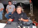 Dan Long Director of Calhoun County EMA and Alabama Region 7 Homeland security trying out the Kenwood TS-2000 with his son Kevin watching in the background