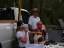 Kate operating while Kari assists and Alan, KB2WF looks on.