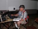 Hal, KD5HWW, demonstrating his cyclops head lamp at the digital station.