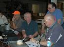 Ricky--AB4FJ (far left) get his packet station on the air while Richard--WA4FEH fires up the PSK-31 rig and Fred--K4LJF, Tom--KG4BIZ and Mike--KC4AHE set up the CW station