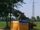 VHF / UHF OPERATION. ANTENNA SUPPORT WAS RAISED BY THE FRONT END LOADER.
