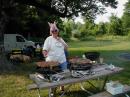 Judith KC8BOM tending to the brats and chicken!  YAY JUDITH!